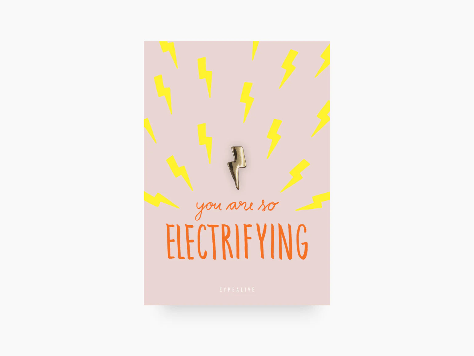 gold plated handmade lightning bolt pin by Typealive, on printed A7 card
