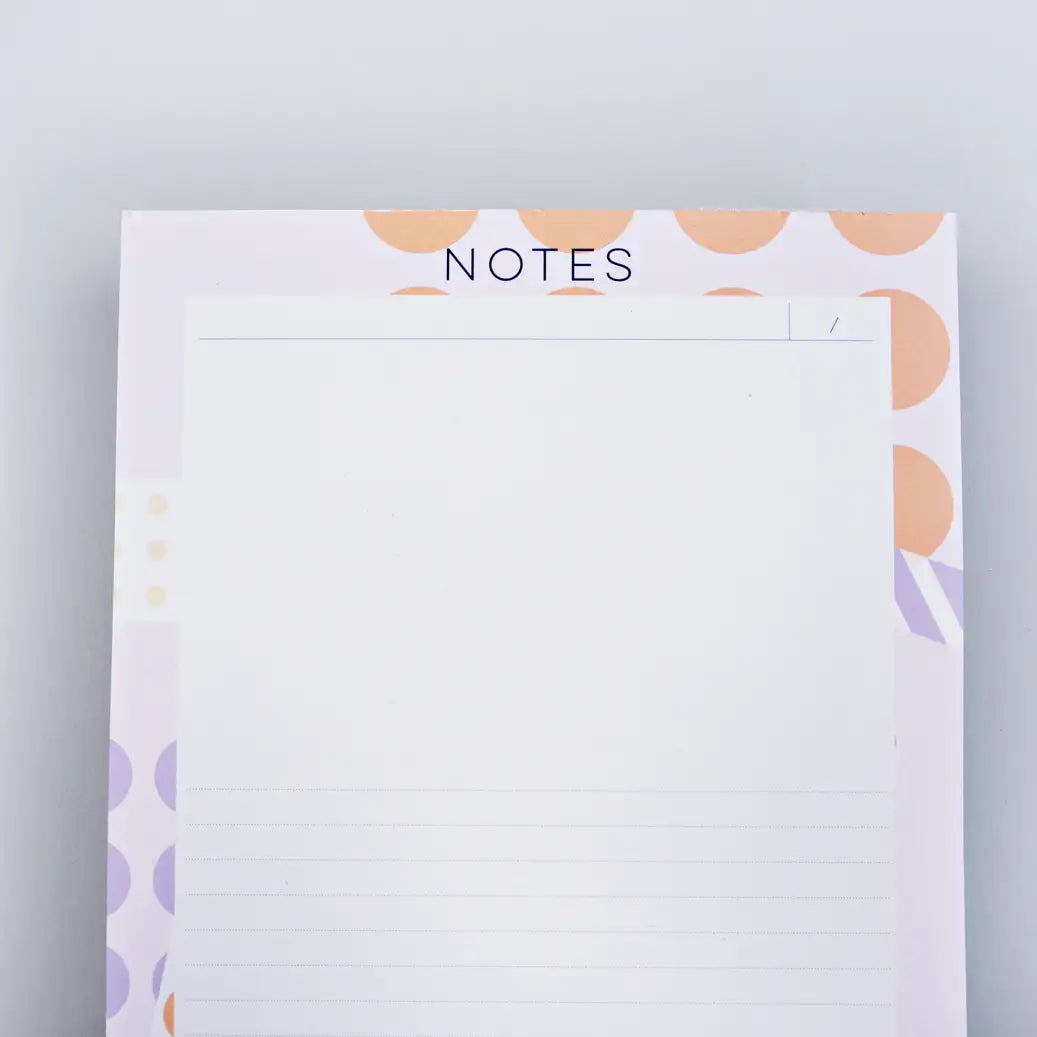 top of note pad ephemera by the completist, with abstract lilac and orange dots