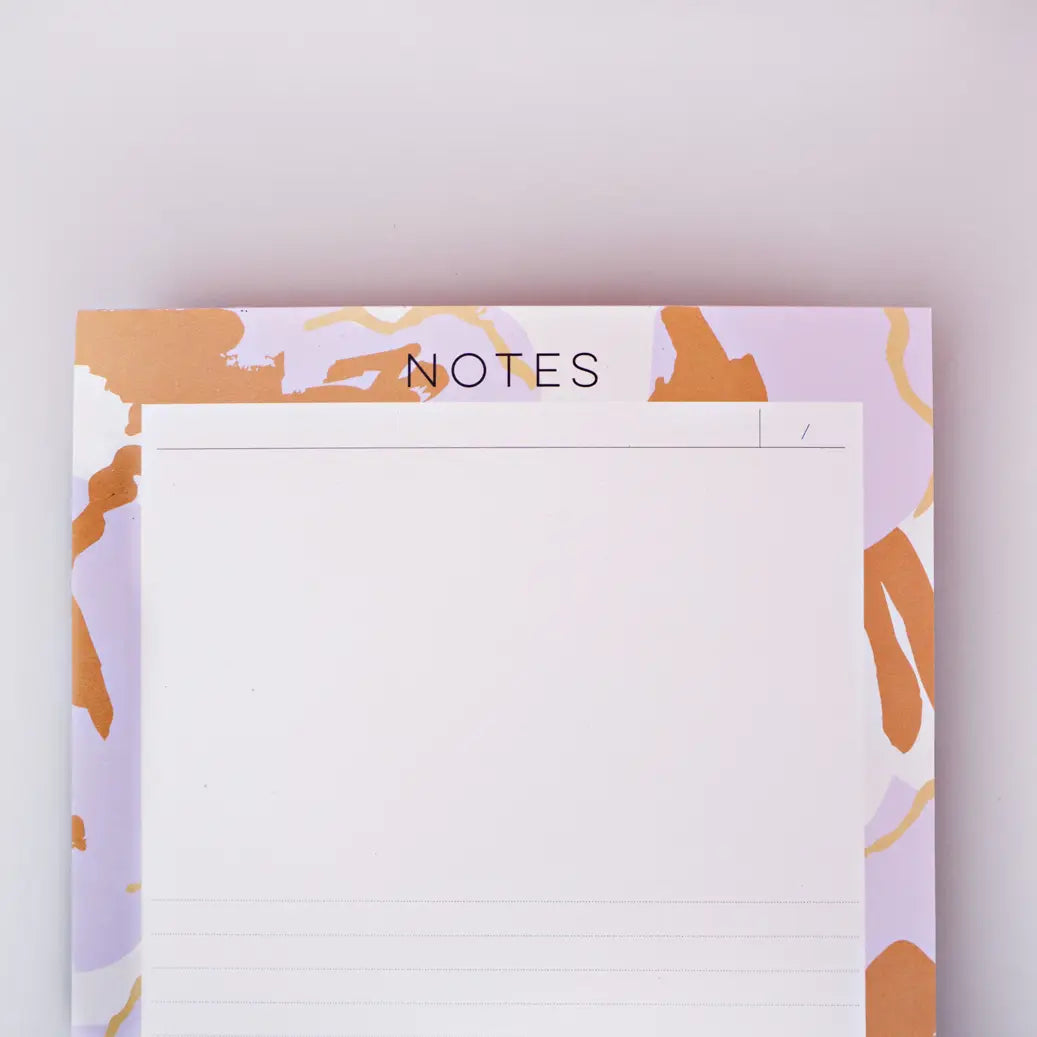 top of note pad kyoto by the completist, with orange and lilac blotches