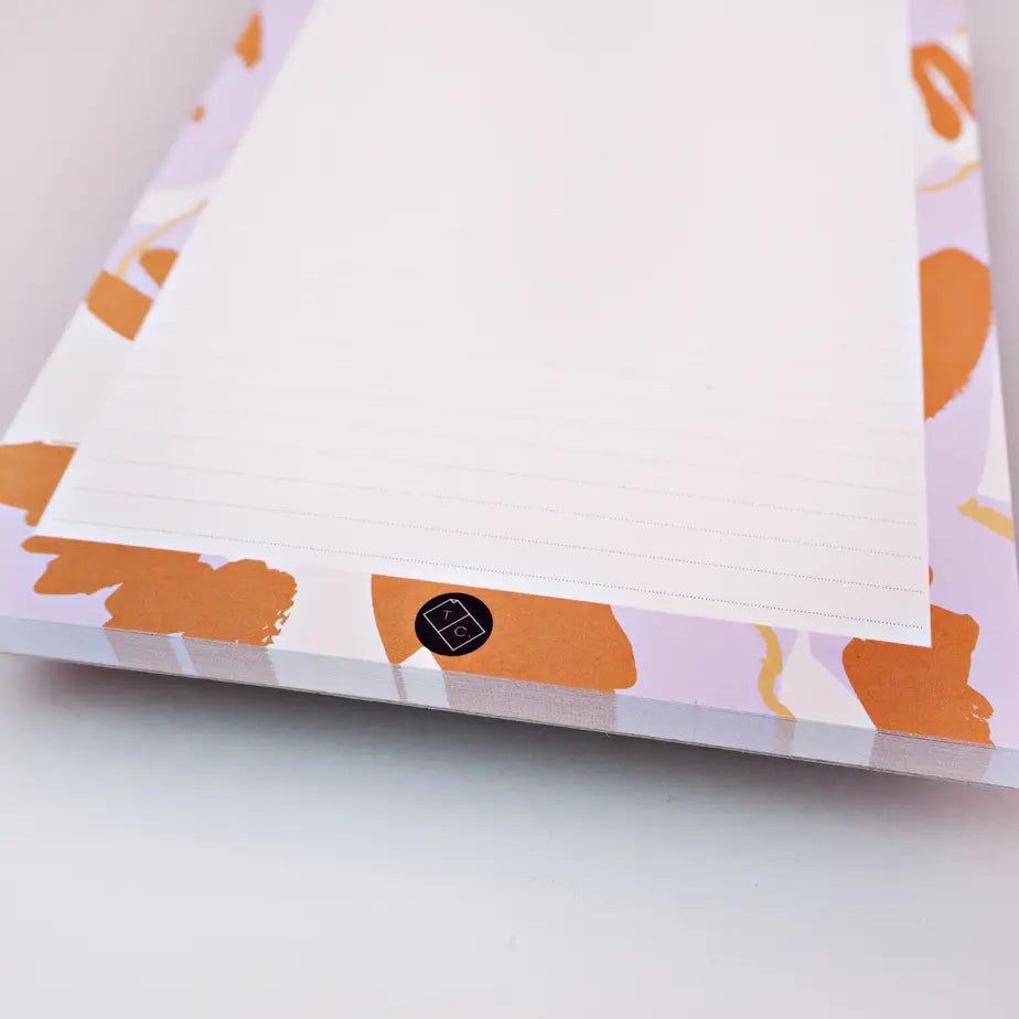 bottom of note pad kyoto by the completist, with orange and lilac blotches
