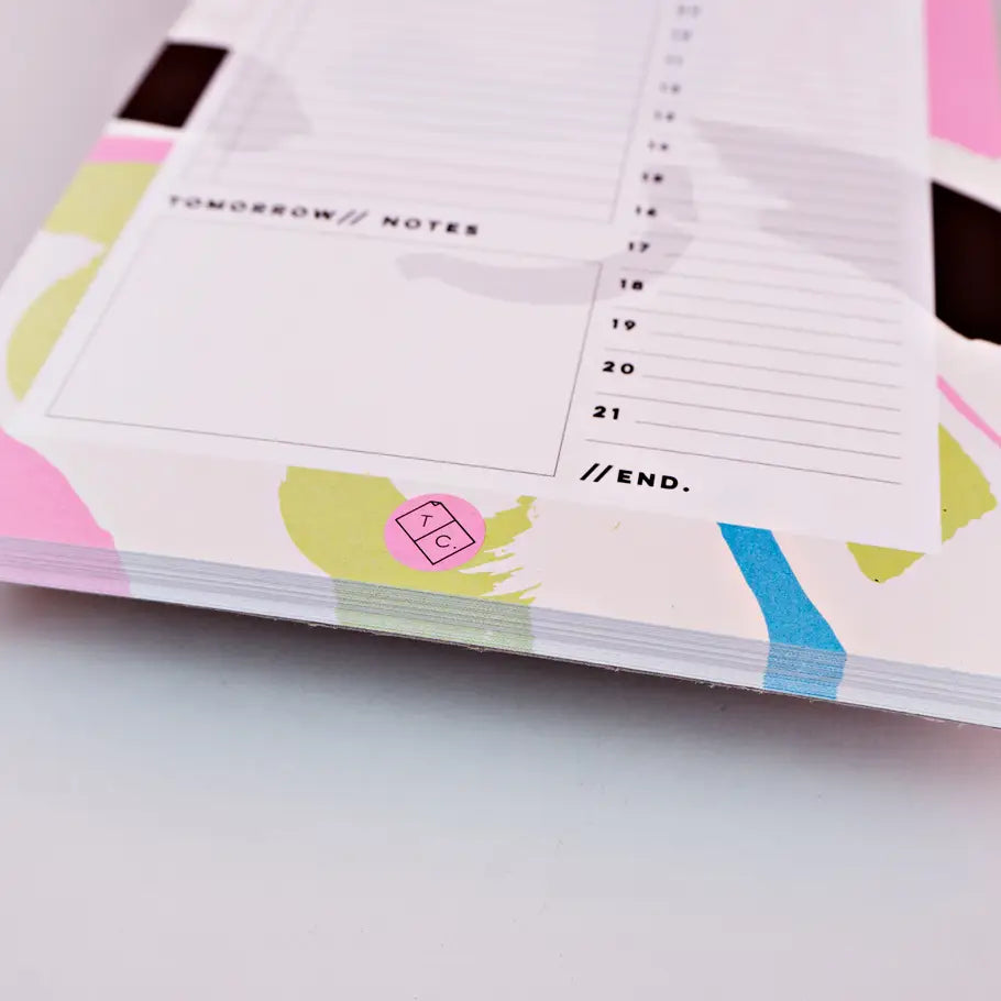 bottom of planner pad orchard by the completist, with shapes in light green, blue, pink and black