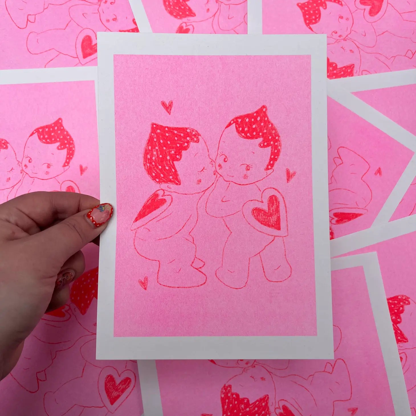 print kissing kewpies by Amy Hastings, handmade neon kissing angels