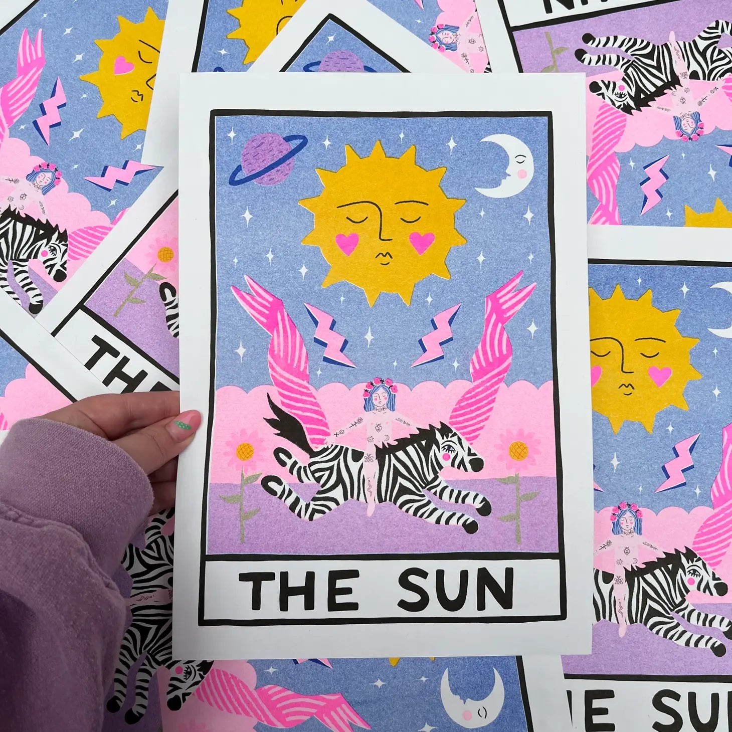 handmade print the sun by Amy Hastings, collage of person on zebra and the sun