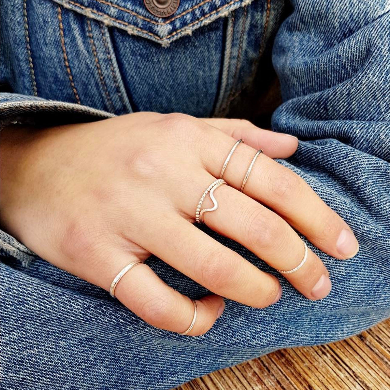 stacker hand with silver Double Trouble, wave ring and pearly stacker