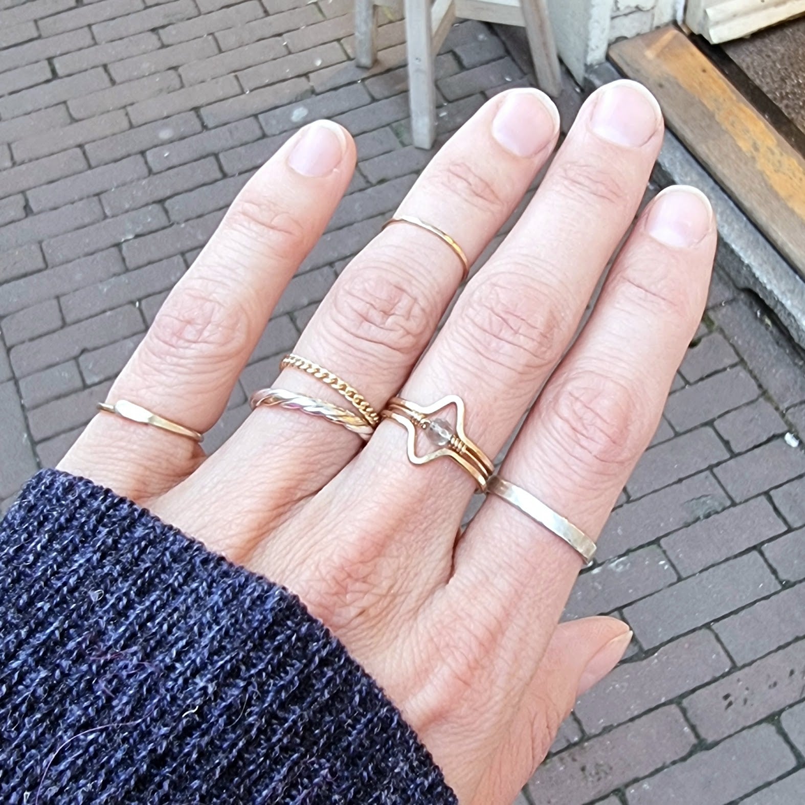 ringstack on hand with hug ring, plain jane 1.0 chain ring and multiple wave rings