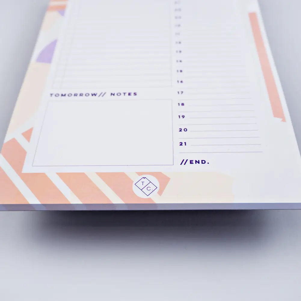 bottom of planner pad spots + stripes by the completist, with abstract light orange stripes and white dots