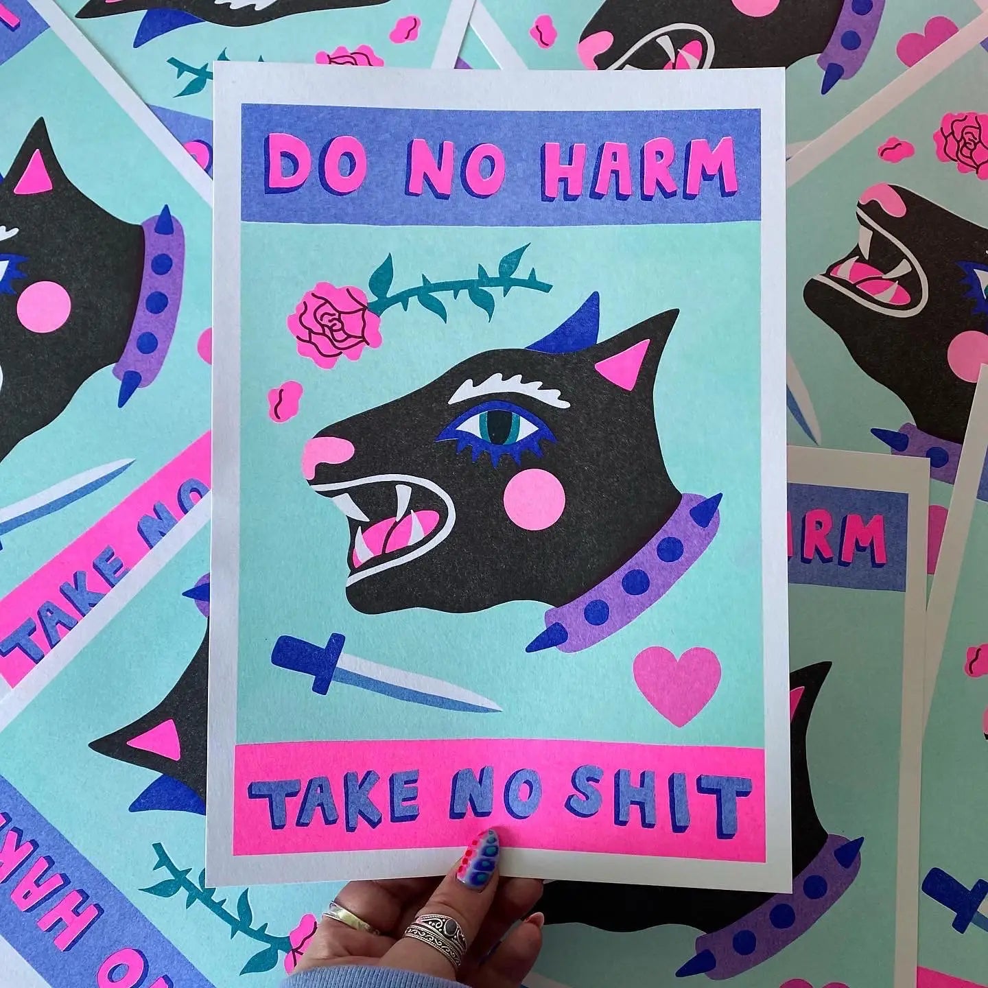 handmade print do no harm by Amy Hastings, light blue background with black dog head