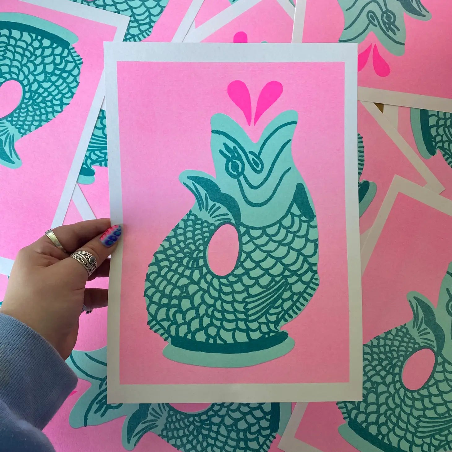 handmade print glugjug by Amy Hastings, neon pink background with green spurting fish vase