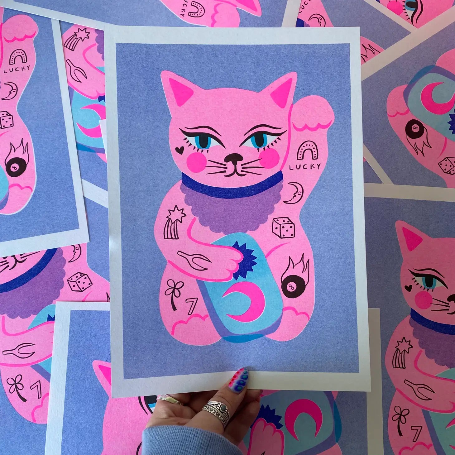 handmade print lucky cat by Amy Hastings, blue background with pink lucky cat