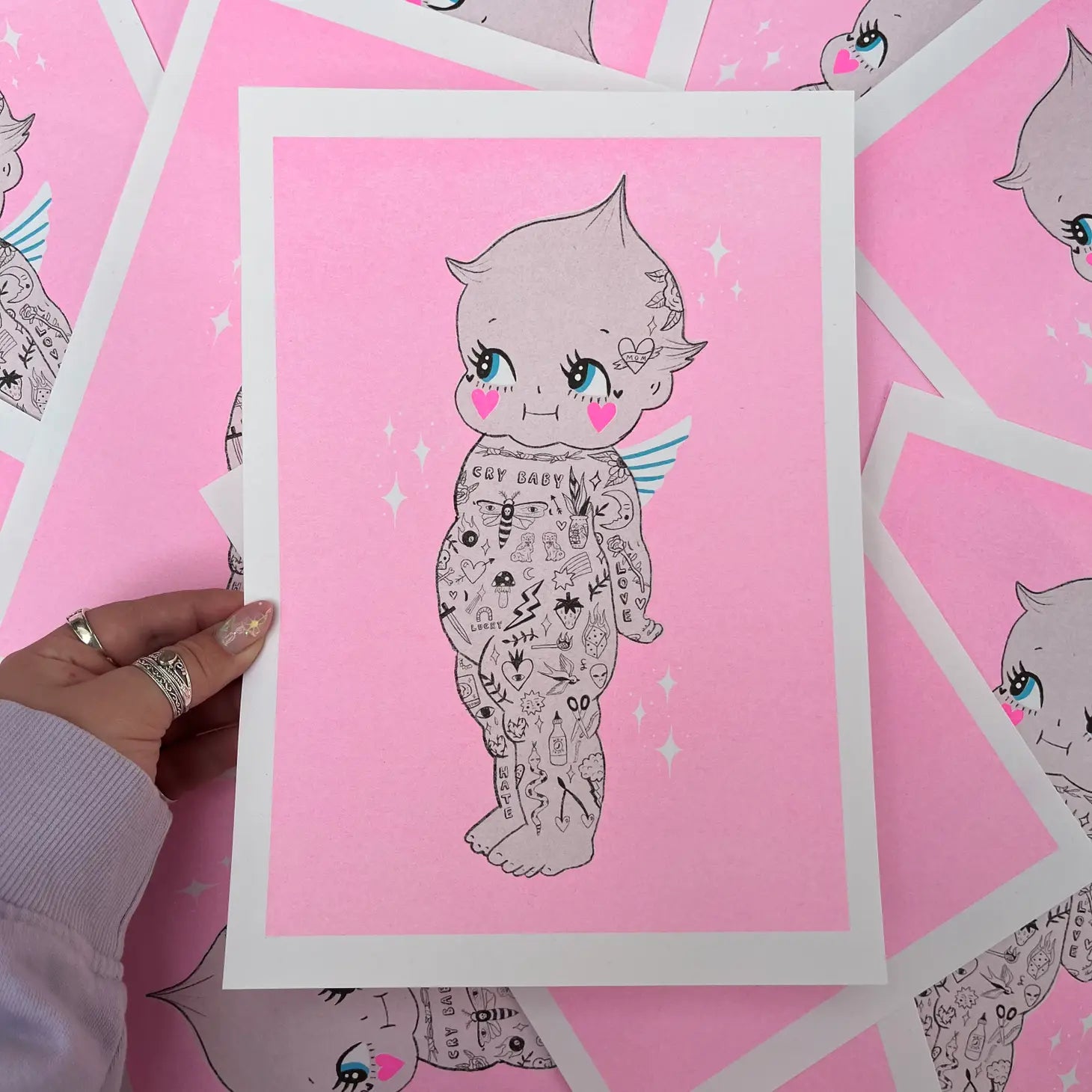 handmade print tattooed kewpie by Amy Hastings, neon pink baby angel